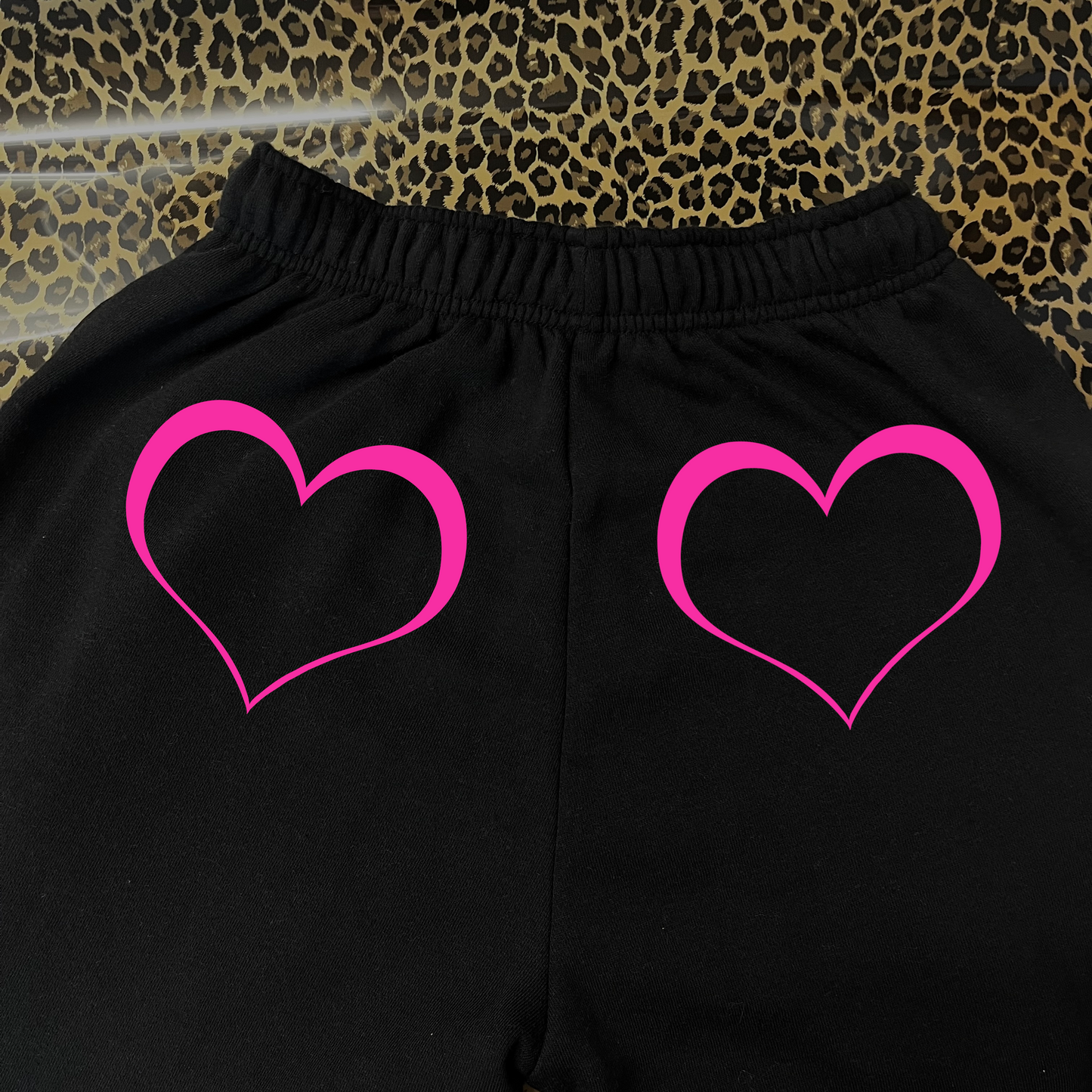 Neon pink lined heart black joggers